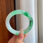 糯冰乌鸡花带色特色翡翠平安镯（54mm）（yc267502）