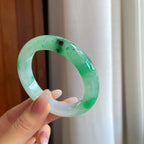 糯冰乌鸡花带色特色翡翠平安镯（54mm）（yc267502）