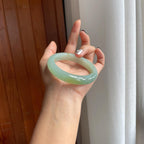 糯冰晴绿底飘黄翡翠平安镯（59mm）（yc277392）