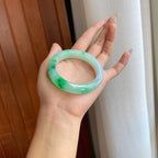 糯冰乌鸡花带色特色翡翠平安镯（54mm）（yc267502）